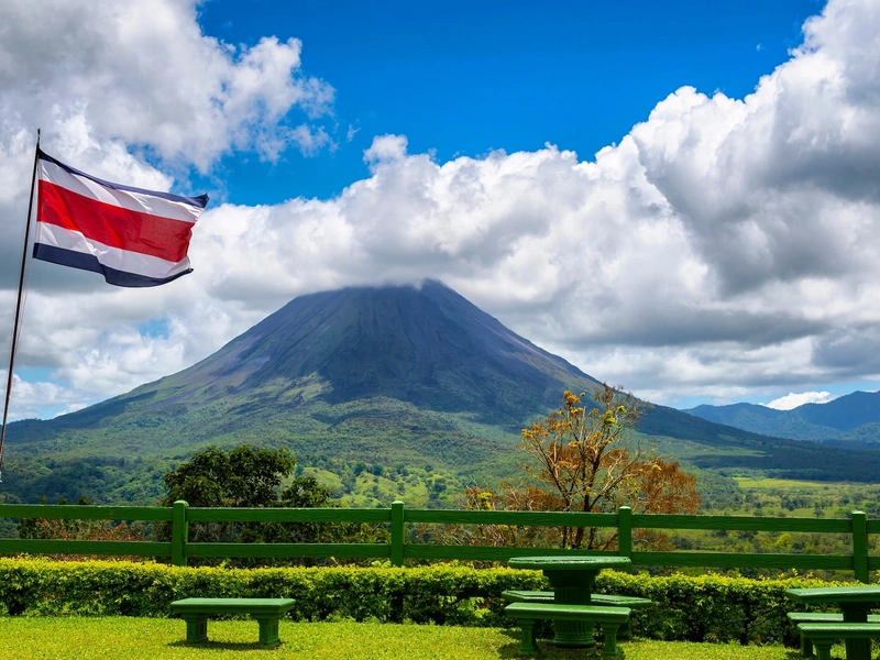 Arenal Volcano behind a hot springs pool