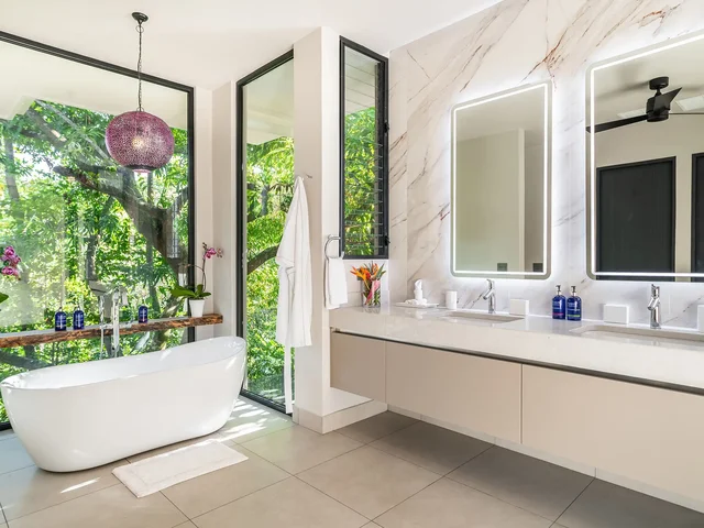 Bathroom with soaking tub at Jungle Haven, surrounded by jungle