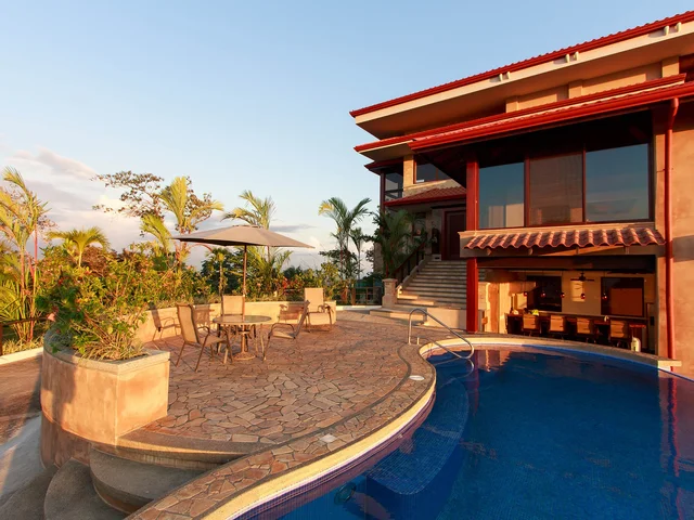 Pool and flagstone deck at Villa Celaje in evening light
